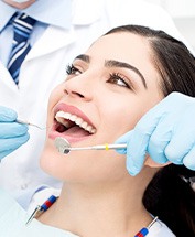 Woman with brown hair and eyes about to undergo dental exam