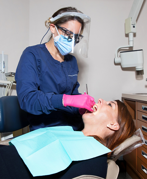 Dentist treating dental patient