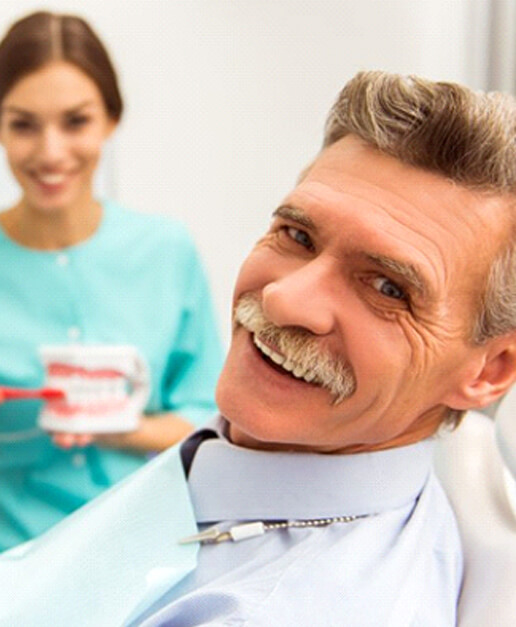 Older man getting dentures in Newport, RI