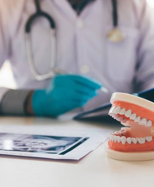 Model of dentures resting on a table in Newport, RI