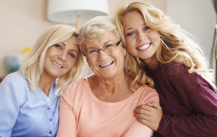 Three women with healthy smiles thanks to preventive dentistry