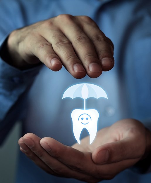 Hands holding animated tooth under an umbrella