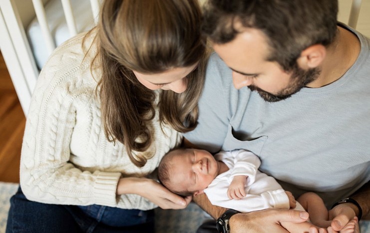 parents holding newborn