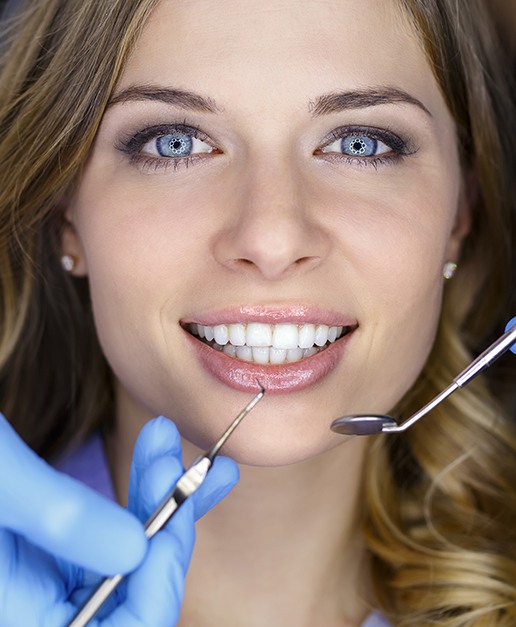 Closeup of patient during preventive dentistry checkup and teeth cleaning