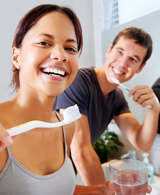 Two patients brushing their teeth