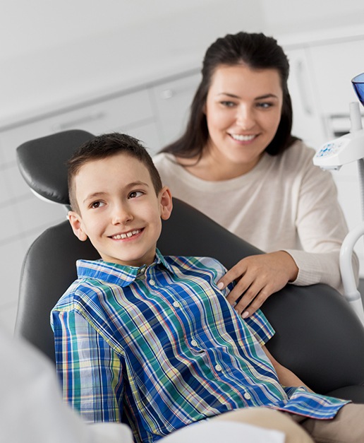 Child receiving dental checkup and teeth cleaning