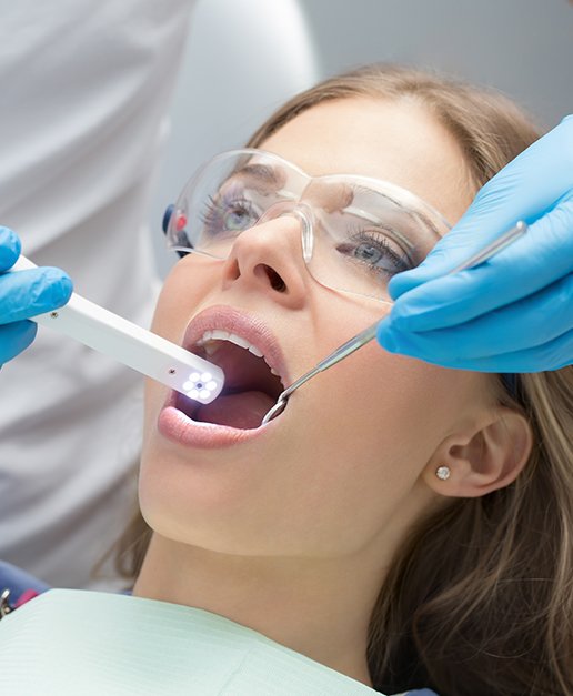 Dentist capturing smile photos with intraoral camera