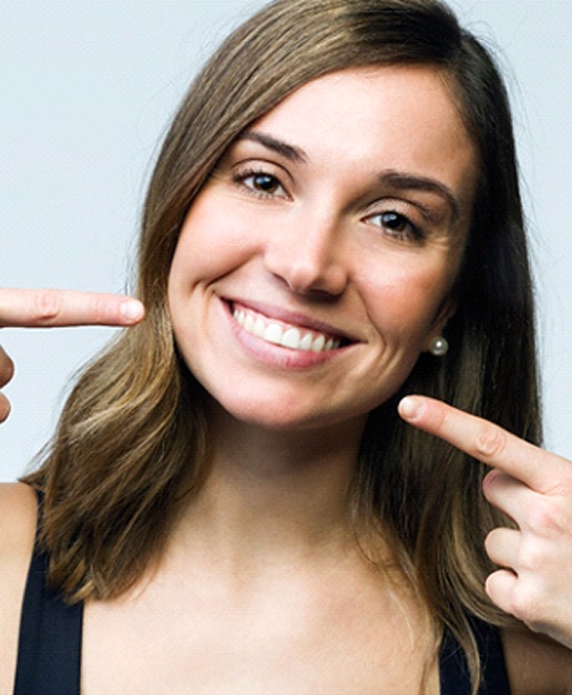 Woman with porcelain veneers from dentist in Newport