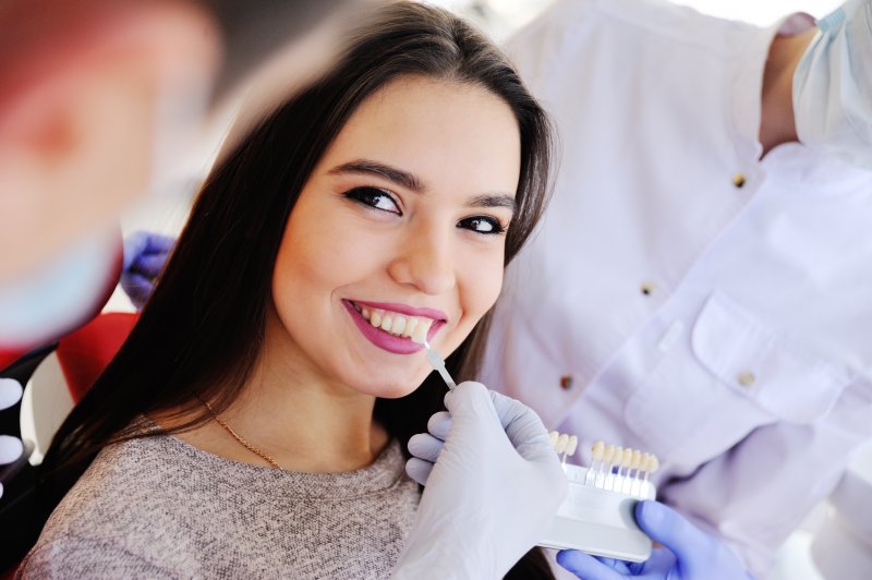 woman starting the veneer process in Newport