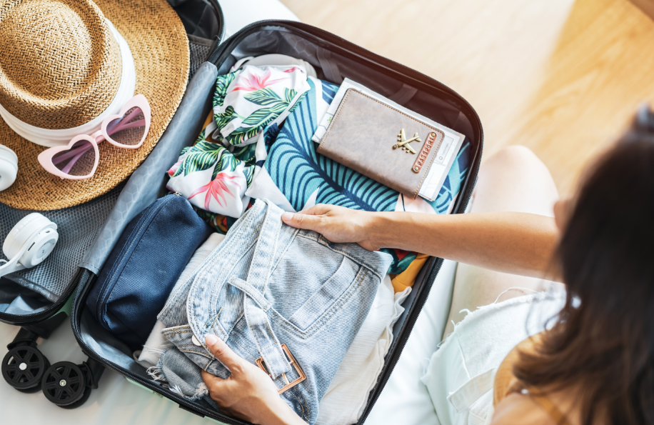 Woman packing suitcase